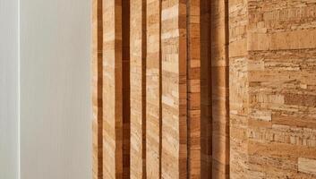 Closeup view of cork wall panels displays the natural texture and organic patterns, emphasizing their use in sustainable soundproofing and insulation. photo