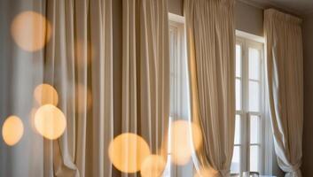 Creamy white blackout curtains covering windows, enhancing insulation and reducing energy consumption by regulating heating and cooling needs. photo