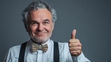 Classic Style GreyHaired Gentleman Gives Thumbs Up Approval photo