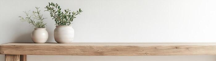 A reclaimed wooden table embraces minimalism with small ceramic pots of greenery. The clean white wall offers negative space, creating a serene and natural atmosphere ideal for decoration photo