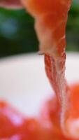 salted red fish Vietnamese summer spring roll making process with rice paper wrapper, woman hand cooking. Top view spring rolls making process video