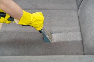 Textile sofa chemical cleaning with professionally extraction method. Upholstered furniture. photo