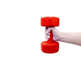 A person's hand holds a red dumbbell. photo