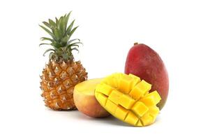 Fresh Pineapple and Mango Display with Diced Mango Cubes on White Surface photo