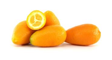 Fresh kumquats showing pulp on white background photo