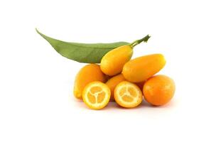 Fresh kumquats with leaf and two halves showing the pulp photo