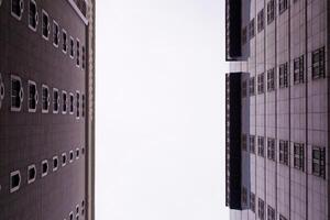 View from below between two tall buildings photo