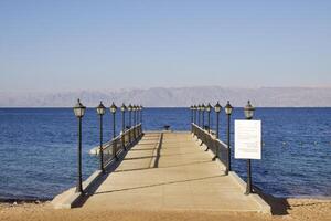 Relax on the beach with umbrellas and sun loungers photo