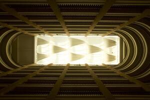 Hotel's open atrium, balconies line, textile ceiling photo