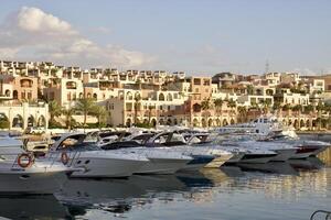 Yachts at the pier in the rays of sunset in Aqaba, Jordan. photo