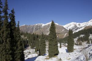 Winter mountain lake surrounded by a mountain rage photo