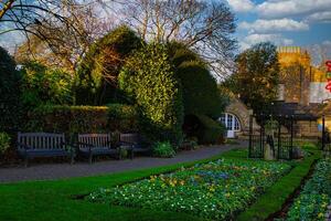 Park Garden with Benches and Stone Building in Wetherby, UK. photo