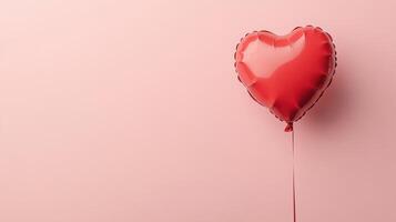 Red Heart Shaped Balloon Floating Against a Soft Pink Background, Perfect for Celebrations, Romantic Occasions, and Love-Themed Designs photo