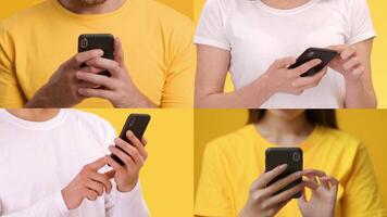 Four individuals engage with their smartphones, displaying various hand gestures while surrounded by a bright yellow backdrop. The lively atmosphere enhances the modern tech experience. video