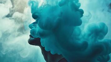 A person stands in a mesmerizing cloud of colorful smoke, their profile illuminated as the vapor swirls around them, creating an imaginative, ethereal atmosphere. video