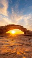 stunning sunset over natural rock arch in desert photo