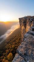 Stunning sunrise over mountain ridge with mist below photo