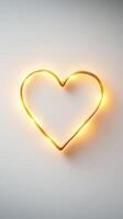 glowing gold heart shape on clean white background evokes warmth and love photo
