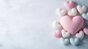 collection of pastel hearts arranged around larger heart, creating soft, romantic feel photo
