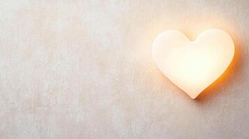 glowing heart shaped light fixture on textured wall creates warmth photo
