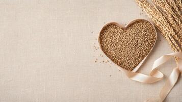 Heart shaped bowl filled with seeds and ribbon on textured background photo