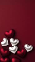 cluster of intertwined silver and red hearts on rich background photo