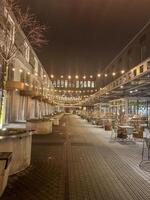 A quiet evening at an outdoor dining area, bathed in soft light. High quality photo