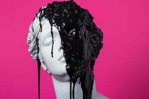 Classical bust defaced with black paint on pink background photo