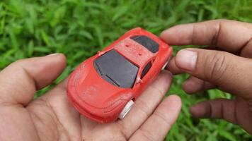 Footage showing a dull red toy car video