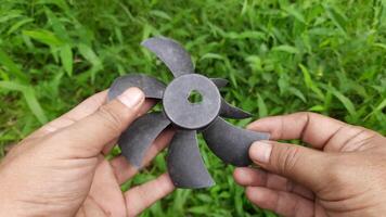 Examination of a Broken Plastic Fan Blade in a Lush Green Environment video