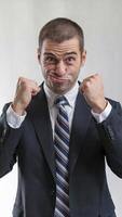 Determined Businessman with Clenched Fists. Portrait of Strength, Ambition, and Drive to Succeed in Corporate World. Business and Motivation Concept. photo