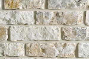 White stone wall design showcasing textured bricks in a modern interior setting photo