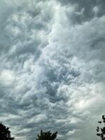 Looming storm clouds create a dramatic prelude to the thunderstorm ahead. photo