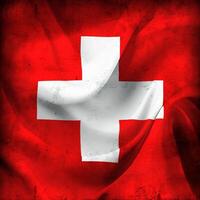 Vintage look Swiss flag - realistic waving fabric flag photo