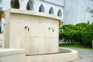 Outdoor ablution tap a place to purify oneself before praying photo