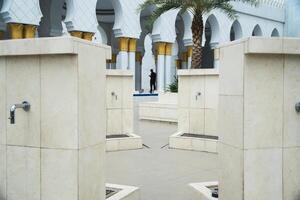Traditional Courtyard Fountain Area with Islam Architecture Elements and Columns photo