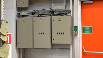 A set of three switching panels with three-phase output control. photo