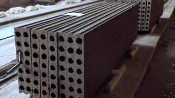 Reinforced concrete slabs stacked together. Plant for the creation of reinforced concrete slabs. Stacks of concrete blocks. Close-up. video