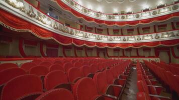 Rows of red chairs in theater hall. Beautiful empty opera house without audience at lockdown time. World crisis, financial losses, consequences of the pandemic. video