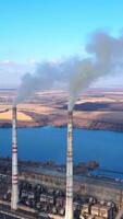 Environmental global warming atmosphere. Aerial view of factory polluted ecology. Full length view Vertical video