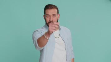 Lebanese man pointing at eyes and camera show I am watching you gesture spying watching on someone video