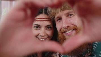 Family married couple makes symbol of love, showing heart sign to camera, express romantic feelings video