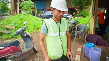 Architect stands at refreshment stall smoking video