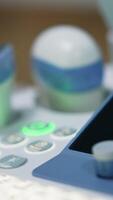 Closer look on keys and buttons of medical equipment in modern clinics. Ultrasound diagnostic machine. Blurred backdrop. video