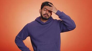 Upset indian man making face palm gesture, loses, feeling bored, disappointed in result, bad news video
