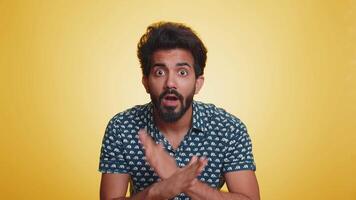 Indian man say No hold palm folded crossed hands in stop gesture warning of finish prohibited access video