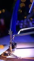 Robotic arm taking the writing pen from a holder and passing it to another arm. Da Vinci robot is getting ready to write. Blurred backdrop. Vertical video