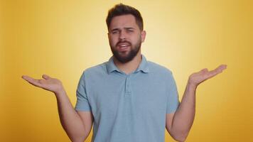 Puzzled clueless uncertain man raising hands in helpless, embarrassed confused by difficult question video