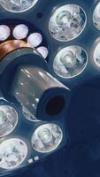 Light equipment on ceiling in operating room. Modern medical lamp with different bright lamps shining. Close-up. Vertical video