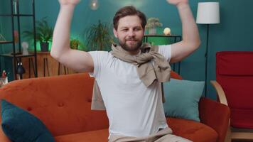Tired young man lying down on comfortable couch, taking a rest, daytime nap relaxing falling asleep video